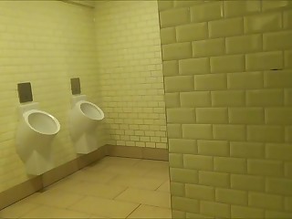 Two girls do blowjob and fuck doggystyle with a random guy in a cafe toilet